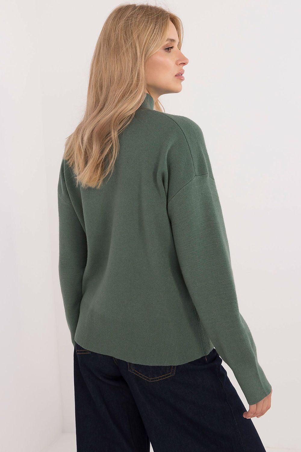 Sublevel's versatile half turtleneck jumper showcased in a casual setting, ideal for layering in autumn and winter looks.