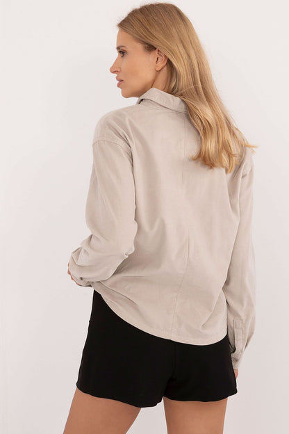 Close-up of Sublevel's stylish long sleeve women's cotton shirt, featuring a classic collar and button closure.