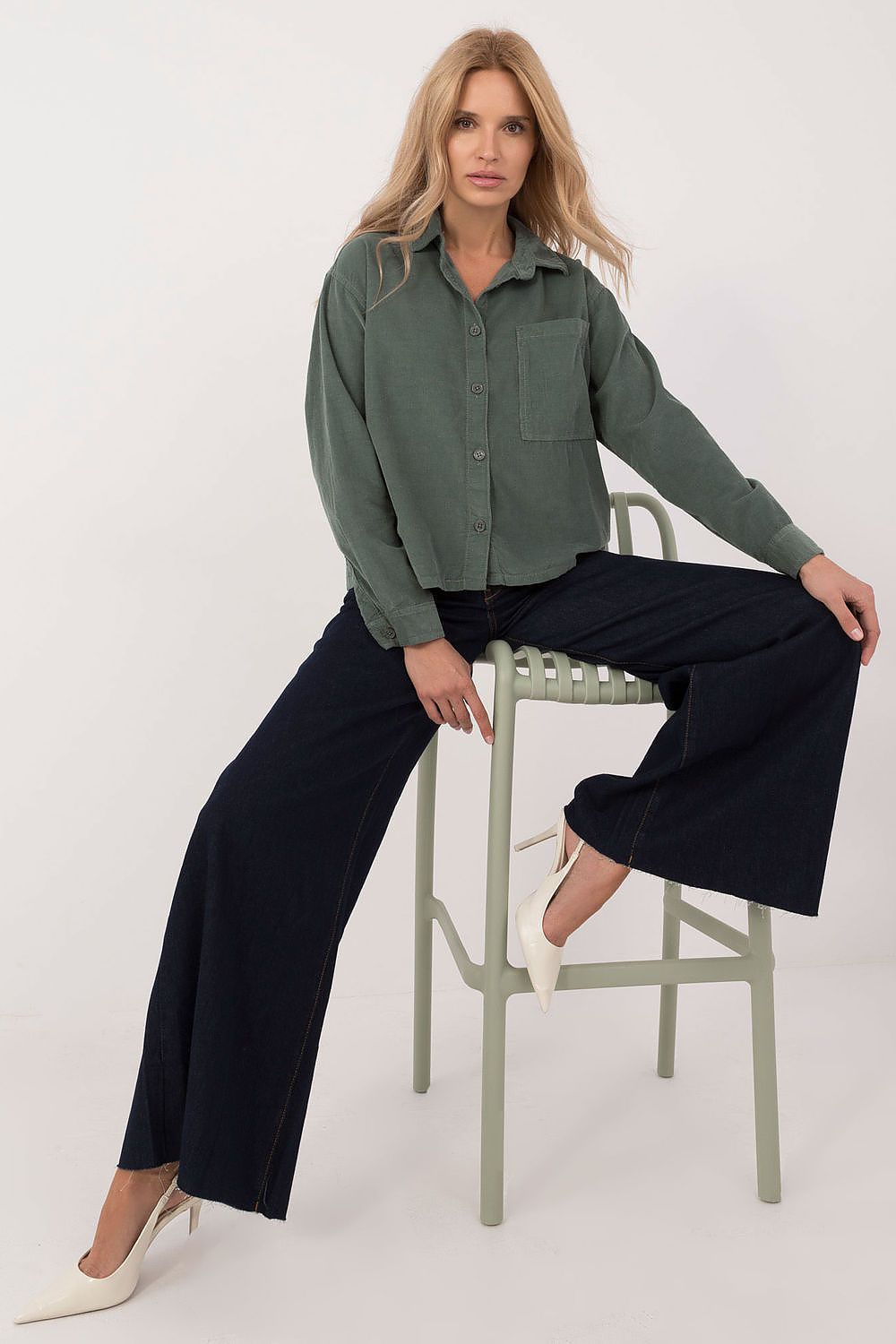 Sublevel women's cotton shirt in a sophisticated setting, perfect for both casual outings and professional environments.
