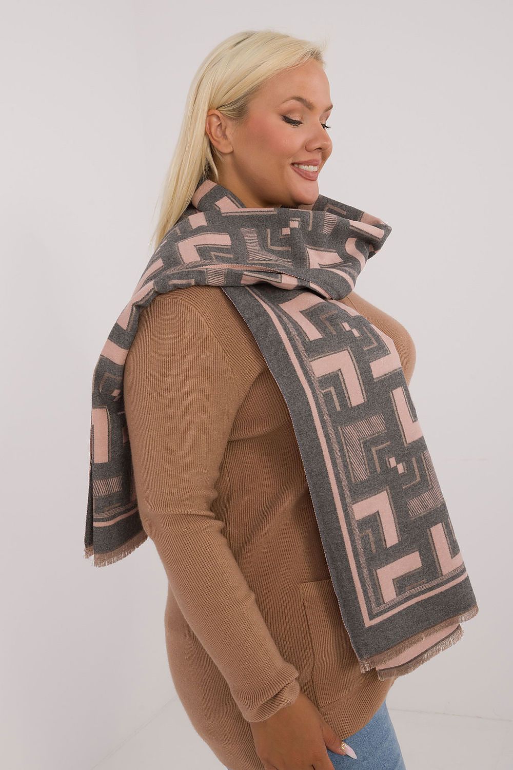 Draped elegant viscose wool shawl scarf by AT, highlighting the chic geometric design and delicate tassels for elevated style.