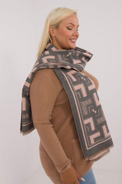 Draped elegant viscose wool shawl scarf by AT, highlighting the chic geometric design and delicate tassels for elevated style.