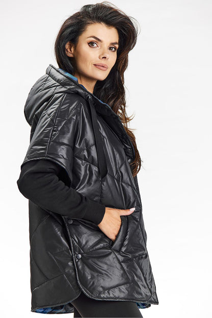 Close-up of the unique printed lining of the luxurious hooded kimono vest by Awama, featuring elegant details and functional press studs for easy wear.