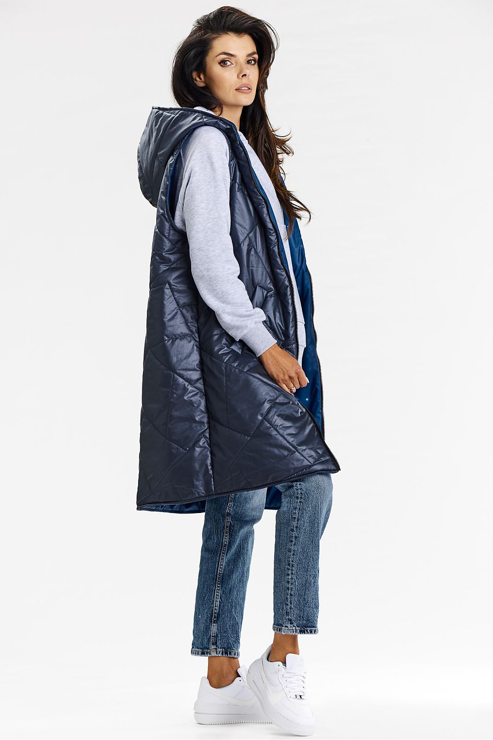 View of the luxurious long cut hooded vest crafted by Awama, highlighting the practical dual-sided design perfect for any occasion.