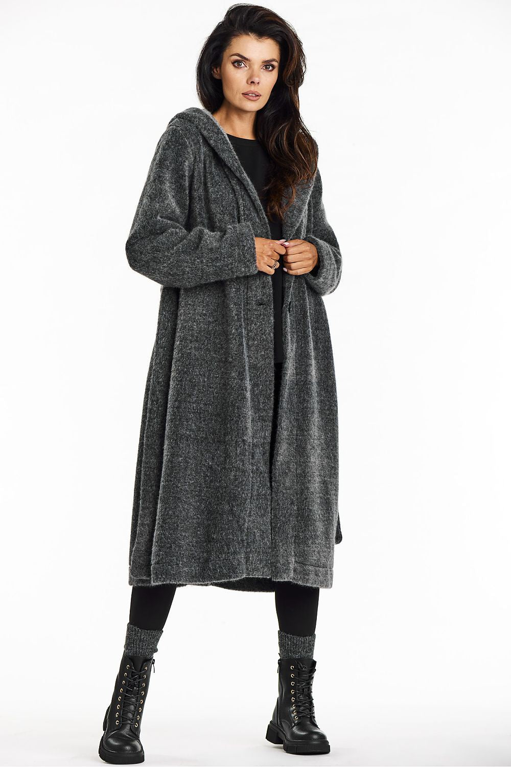 Back view of the Awama long hooded coat, emphasizing its elegant cut and tied waist detail in plush teddy knit fabric.