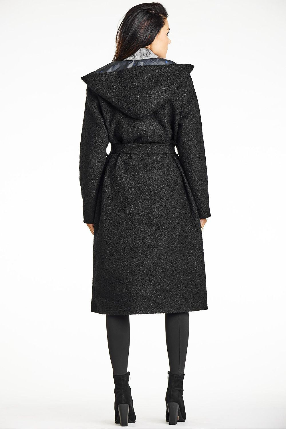 Elegant green bouclé coat with shawl collar and hood by Awama, styled with a waist belt, perfect for autumn's chic looks.