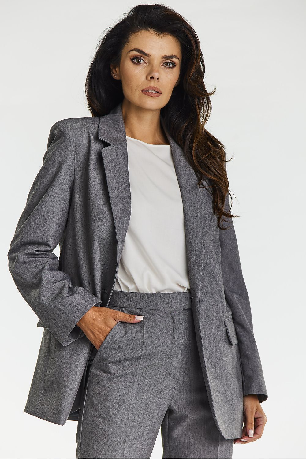 Elegant Grey Loose Fit Jacket with Contrasting Black Lining by Awama, perfect for both casual and professional occasions, highlighting sophisticated style and comfort.