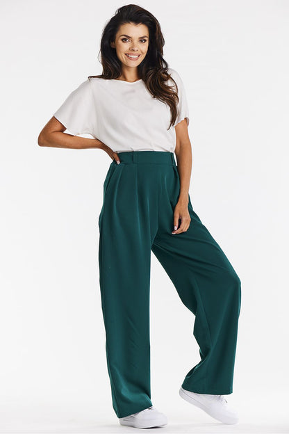 Elegant gray wide-leg trousers for women by Awama displayed with various footwear options, showcasing versatility in casual and elegant styling.