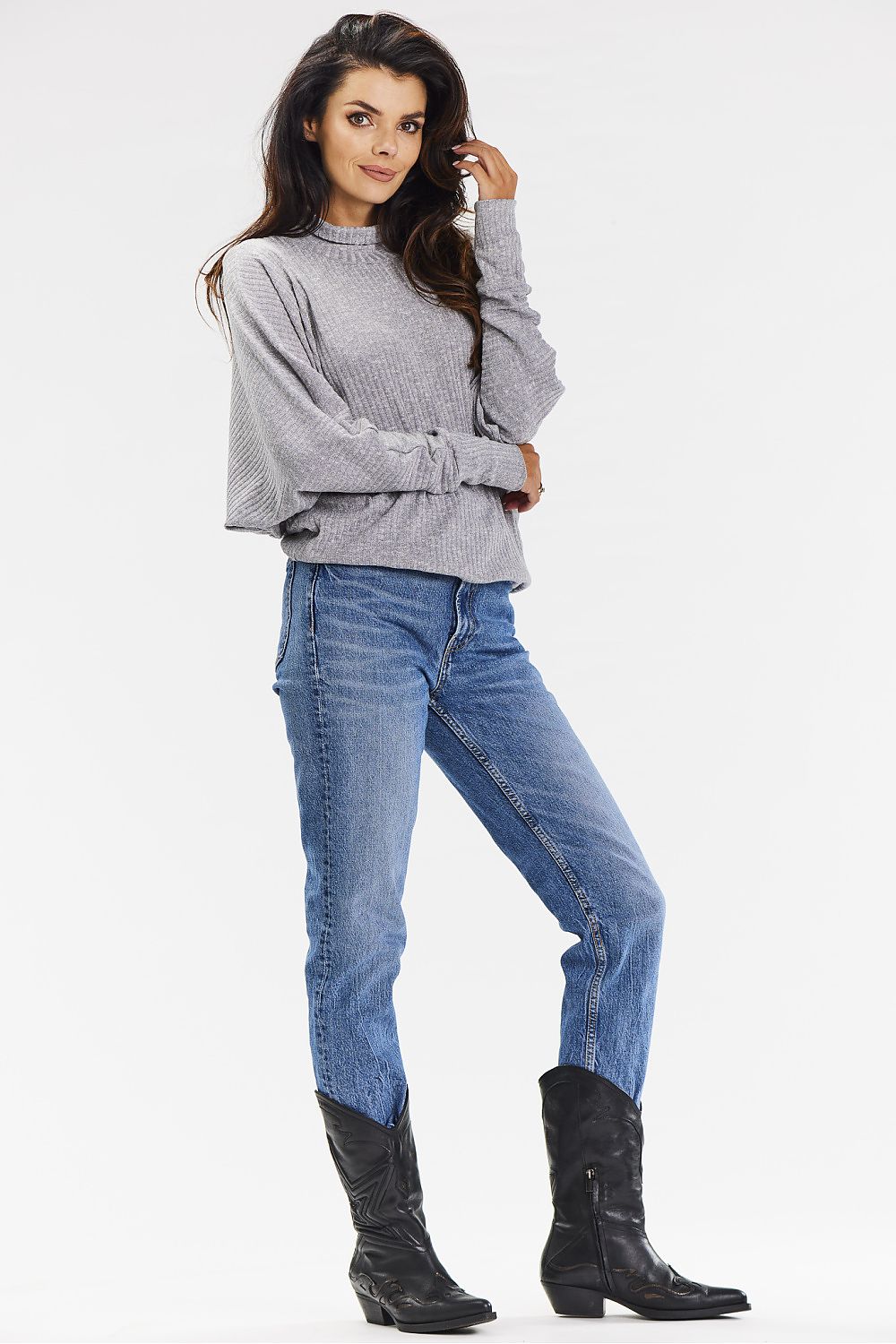 Close-up of the luxurious ribbed knit fabric of the Awama turtleneck sweater, showcasing its soft texture and elegant design.