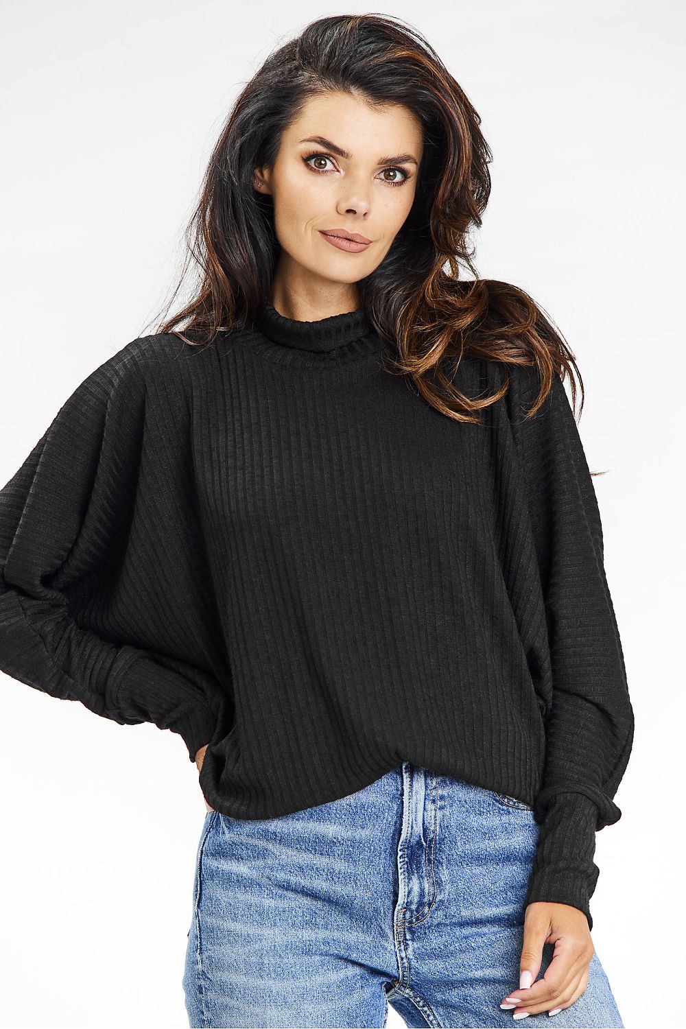 Awama's black loose-fitting turtleneck sweater with kimono sleeves, styled for a chic autumn outfit.