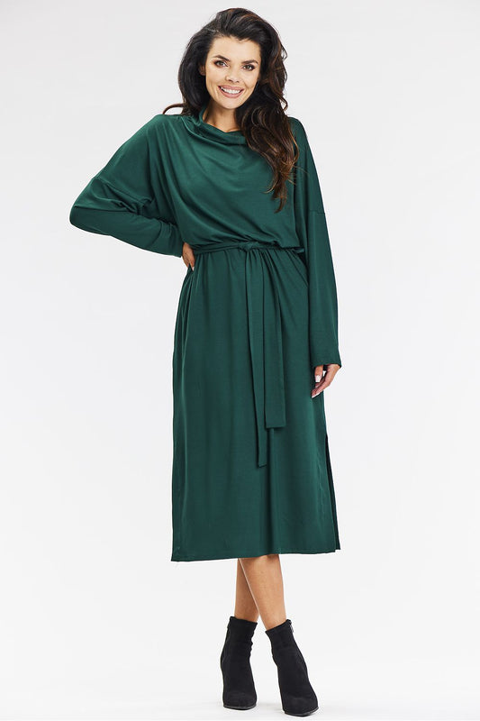 Stylish green kimono midi dress featuring a loose turtleneck and side slits, perfect for a sophisticated look by awama.