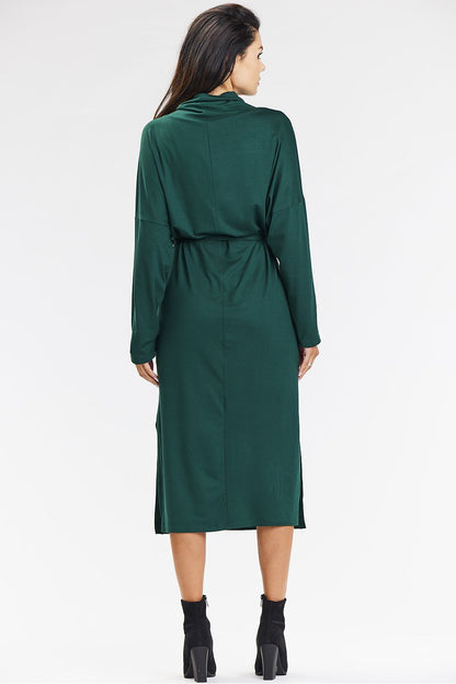 Elegant turtleneck midi dress in vibrant green by awama, ideal for casual outings or work, combining modern style with comfort.