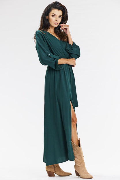 Beautifully crafted green maxi dress in a loose envelope style by Awama, featuring an elastic waistband and a graceful silhouette that adds comfort and elegance.