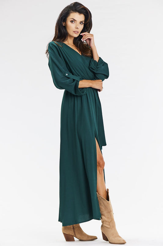 Beautifully crafted green maxi dress in a loose envelope style by Awama, featuring an elastic waistband and a graceful silhouette that adds comfort and elegance.