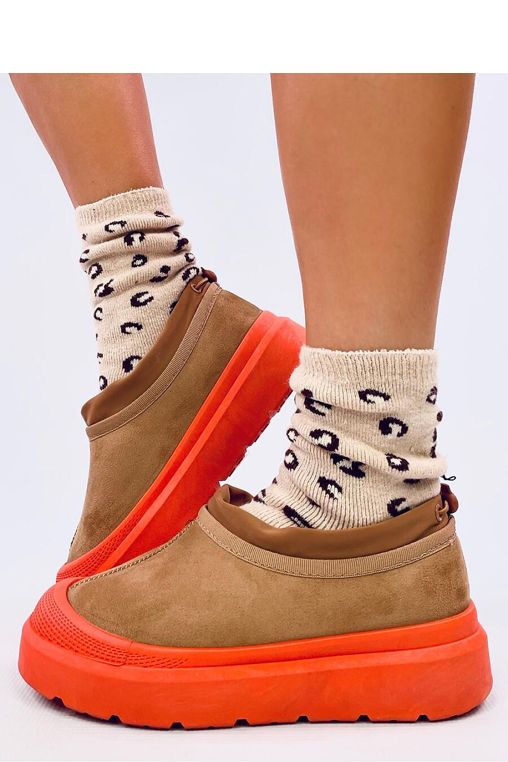 Luxury women's short snow boots by Inello featuring a non-slip rubber sole and thick fur lining for ultimate comfort in cold weather.