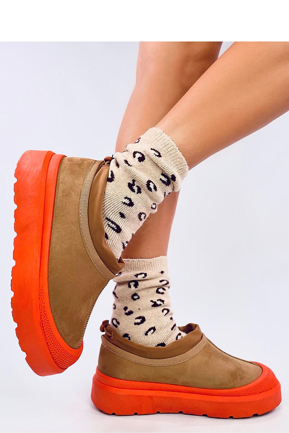 Elegant luxury snow boots for women from Inello, showcasing a unique cut and thick fur lining for cosy winter style.