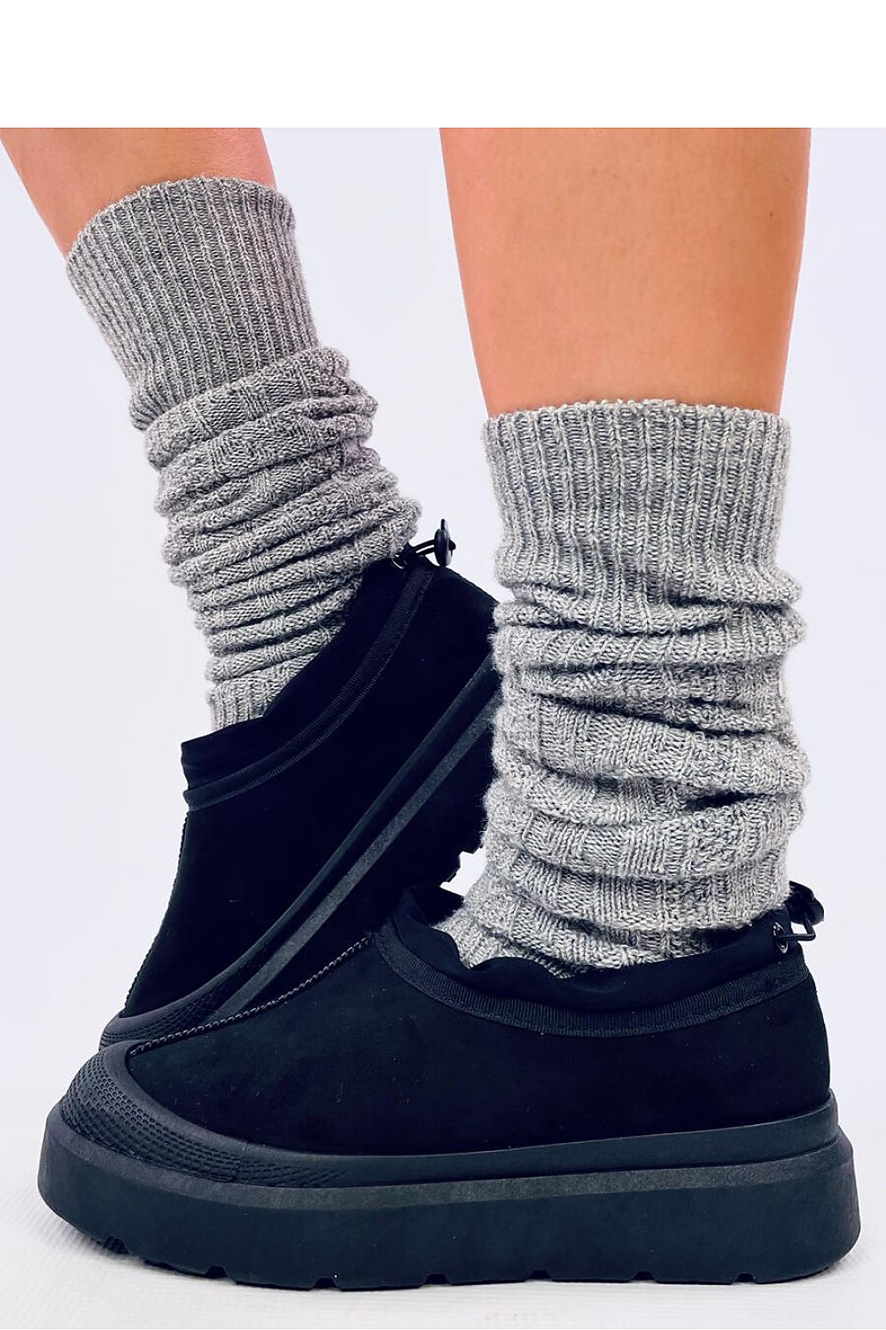 Elegant Inello short snow boots with eco-friendly suede exterior and plush fur lining, perfect for wintery conditions.