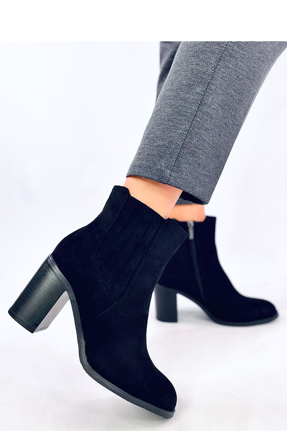 Elegant Women's Black Heel Boots by Inello, featuring an 8cm heel height, elastic insert, and luxurious soft fur lining, perfect for autumn styling.