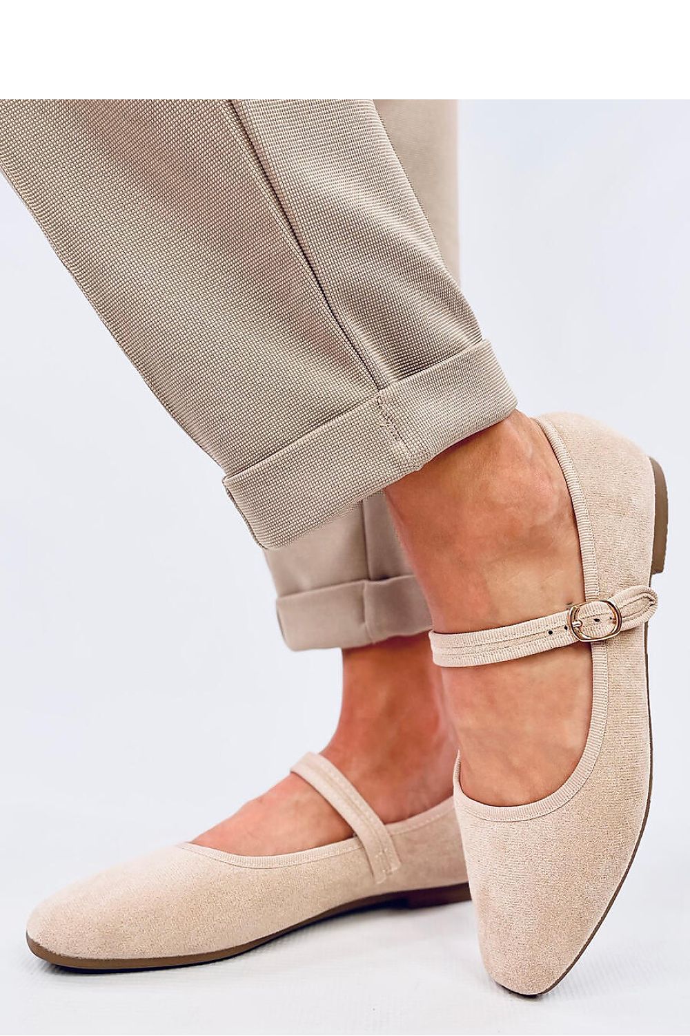 Close-up view of Inello's elegant suede ballet flats for women, featuring a fashionable Mary Jane strap and sophisticated eco-friendly craftsmanship.