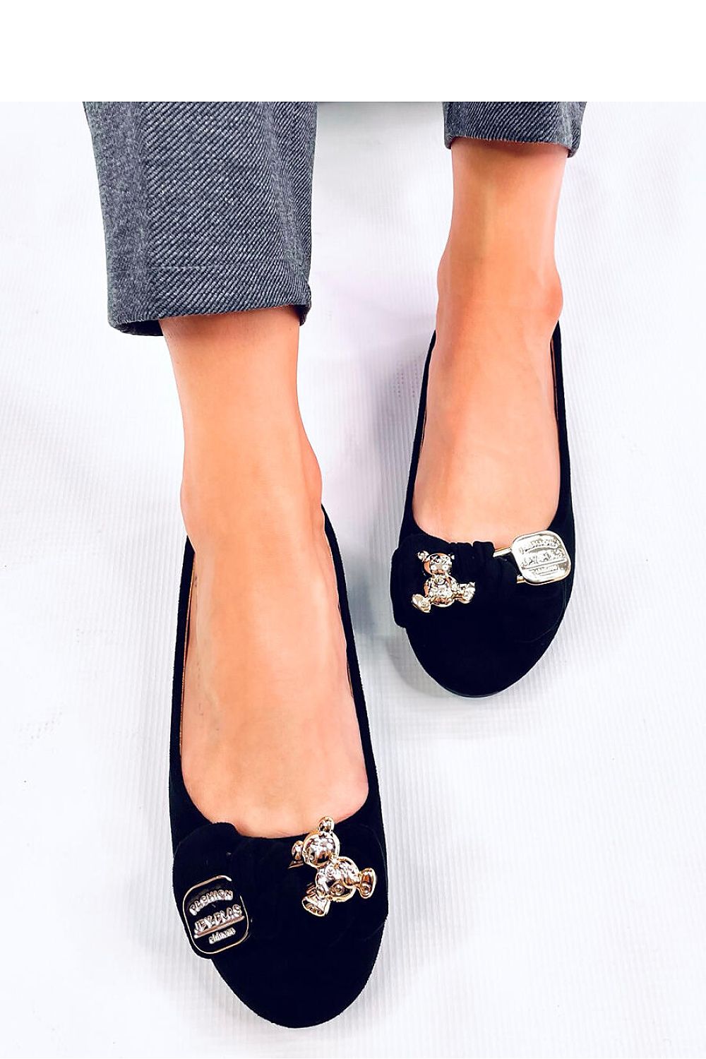 Elegant Women's Luxury Suede Ballerinas by Inello, featuring a stylish bow and gold pin, showcasing a comfortable round-toe design perfect for casual chic outfits.