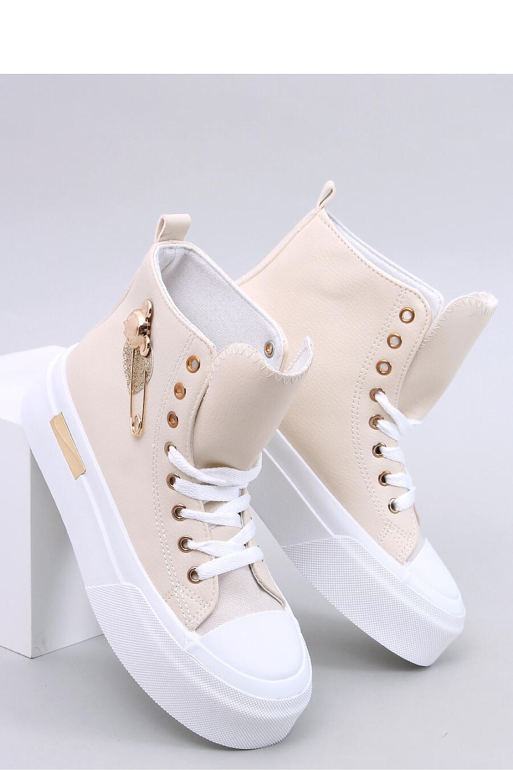 Stylish ankle model women's eco leather sneakers by Inello, featuring a high springy rubber sole and luxurious gold detailing.
