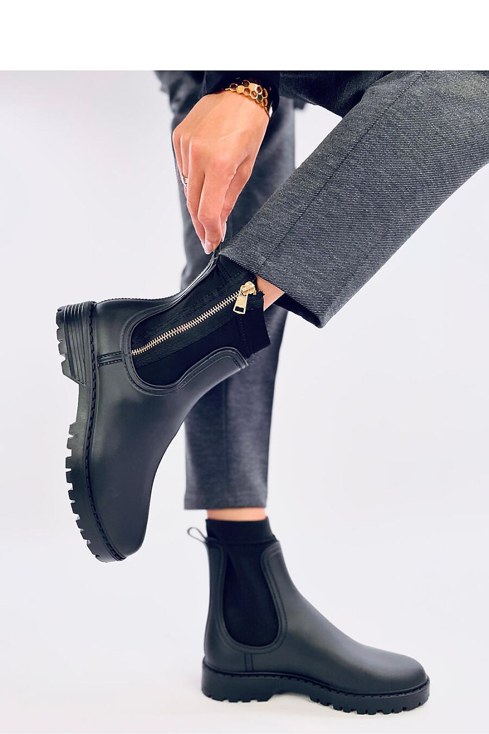 Luxurious Inello women's wellingtons crafted from durable rubber, showcasing a fashionable gold zipper.