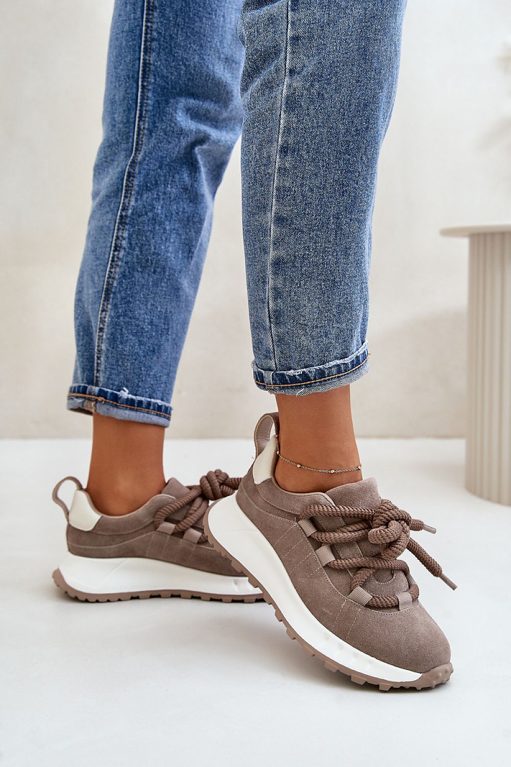 Step in Style women's luxury platform sneakers made of natural suede, featuring distinctive thick lacing for a chic look.