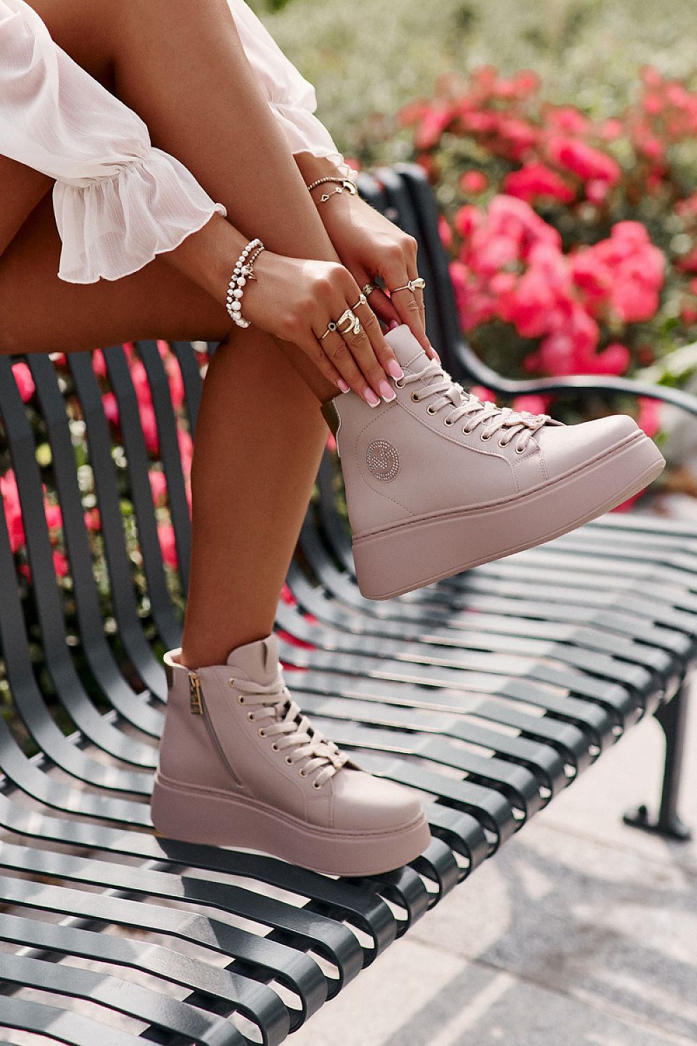 Close-up of Vinceza women's natural leather sneakers, featuring elegant detailing and a warm shoe cover for comfort and style.