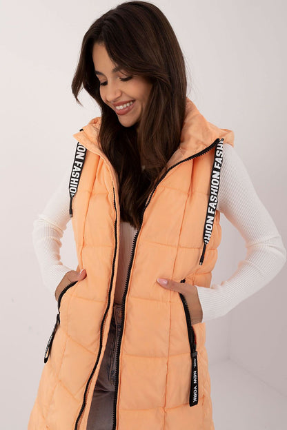 Stylish quilted zippered vest with hood, crafted from durable polyester by Factory Price, designed for warmth and sophisticated elegance in all seasons.