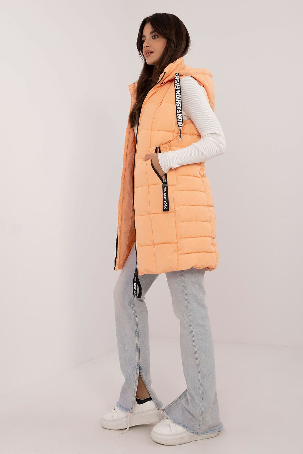 Stylish quilted zippered vest with hood in luxurious design, made by Factory Price, ideal for warmth in colder seasons.