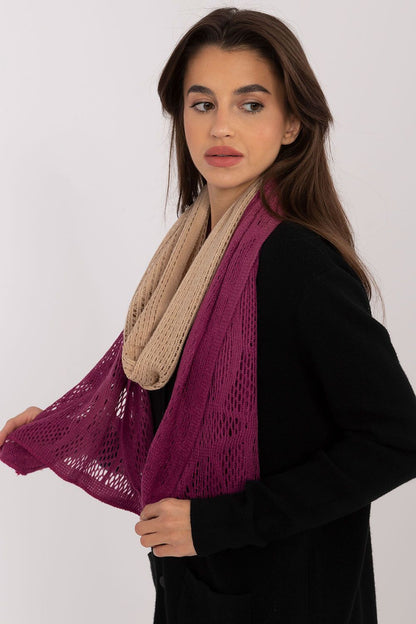 AT's elegant openwork scarf, measuring 190 cm, crafted from premium cotton and wool, adding a touch of sophistication to autumn and winter wardrobes.