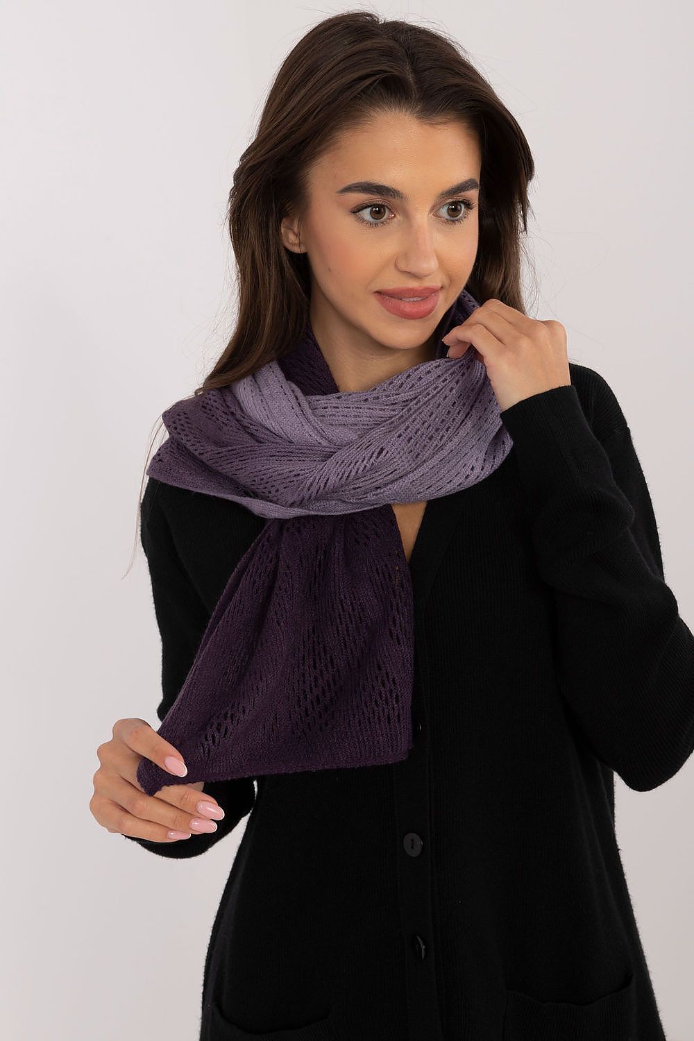 Luxurious openwork scarf by AT showcasing delicate patterns, made from a blend of cotton and wool for warmth and elegance.