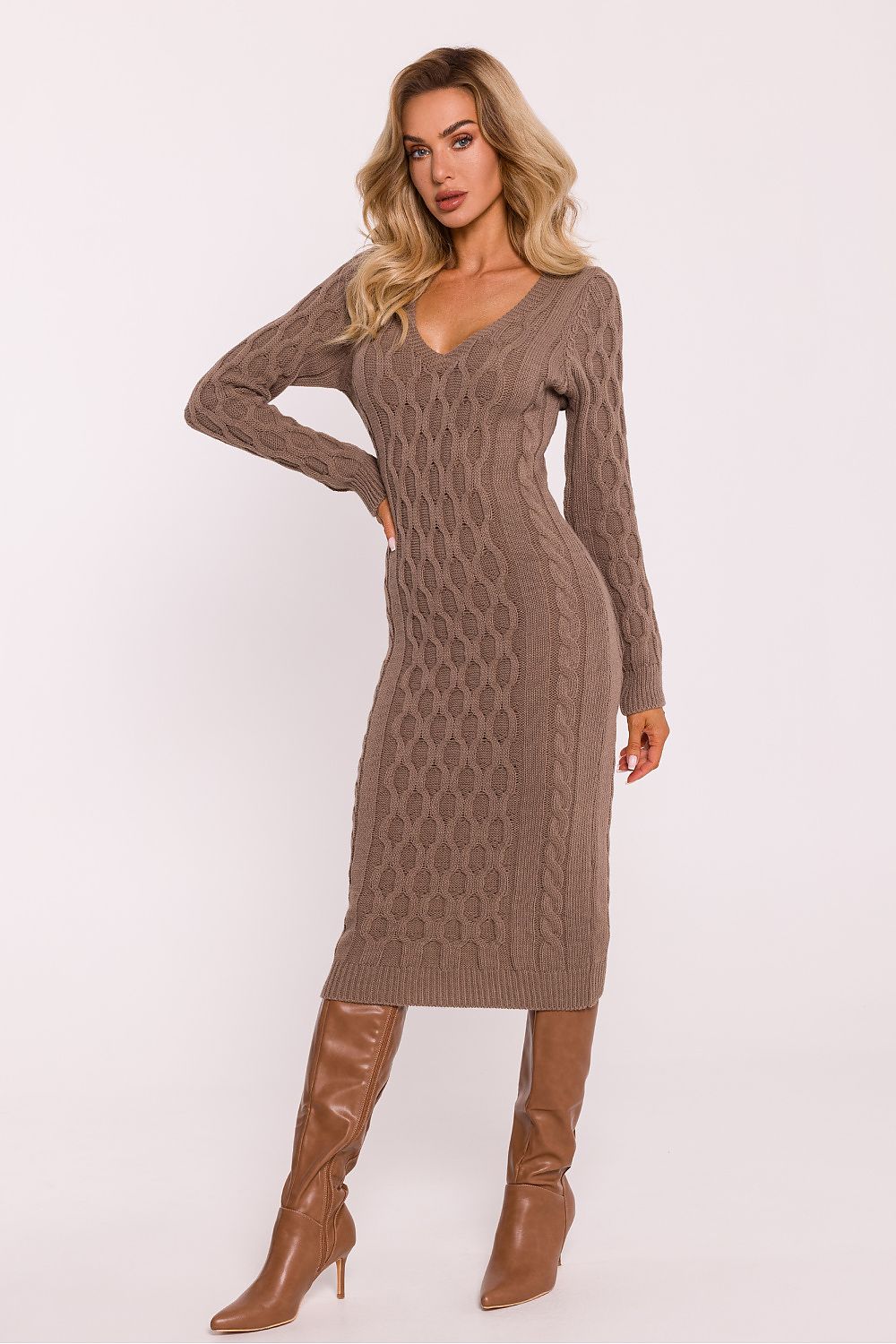 Model wearing Moe's chic midi sweater dress with long sleeves and a refined V-neckline, perfect for versatile styling.