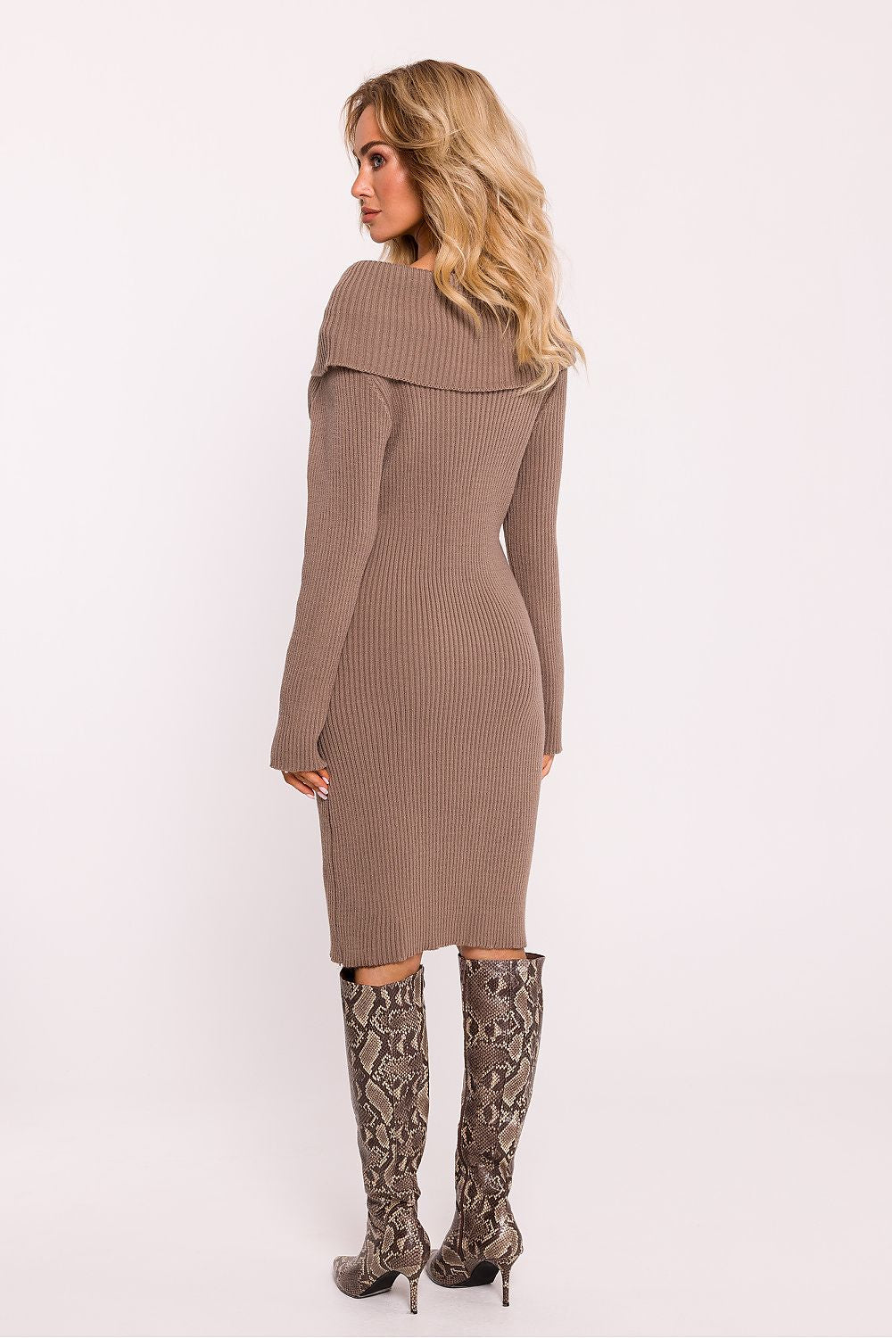 Moe's elegant long-sleeved ribbed sweater dress styled for cold weather, embodying warmth and sophistication.
