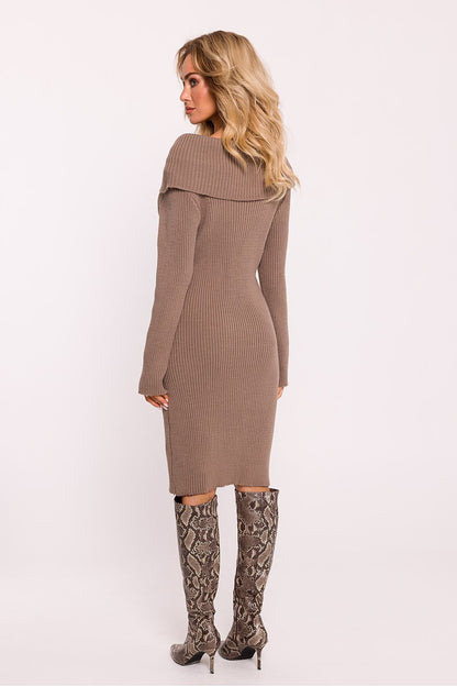 Moe's elegant long-sleeved ribbed sweater dress styled for cold weather, embodying warmth and sophistication.