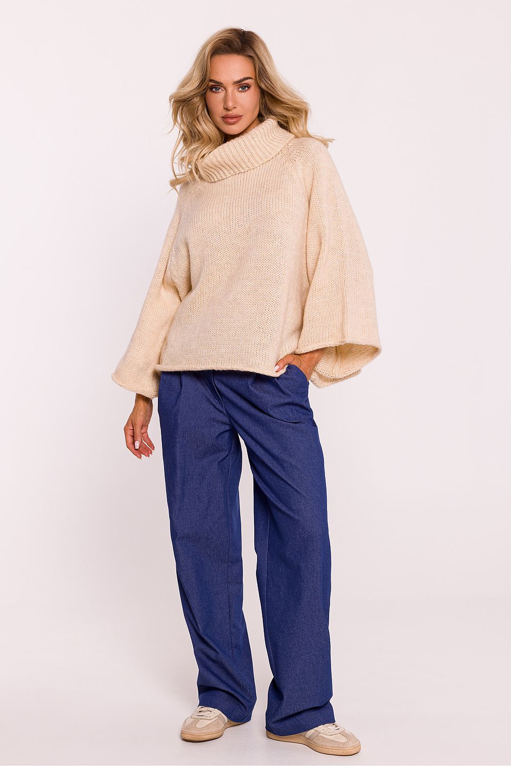 Moe's luxurious oversized turtleneck sweater with wide 7/8-length sleeves, perfect for chic casual styling.