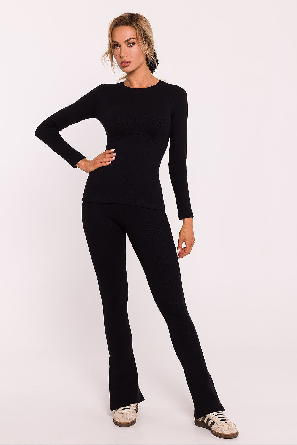 Delicate details of long-sleeved corset style blouse in ribbed cotton knit by Moe, showcasing a blend of classic elegance and modern fashion.