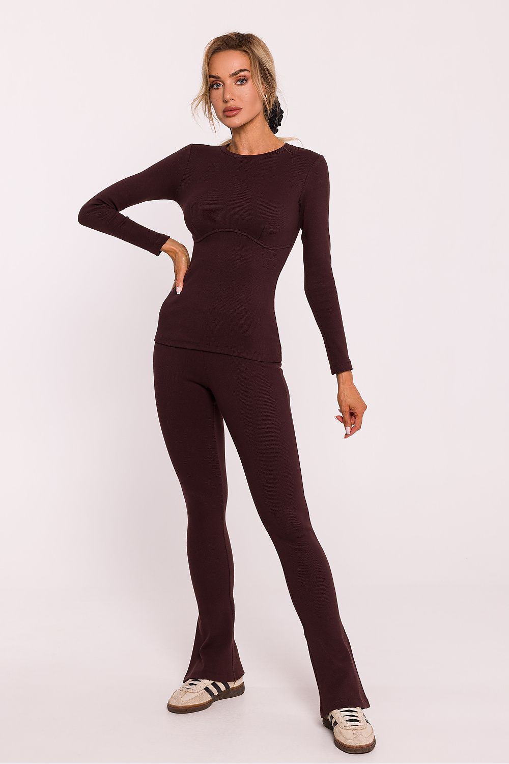 Back view of the elegant ribbed cotton knit blouse by Moe, featuring long narrow sleeves and a chic corset silhouette, designed for a flattering fit.