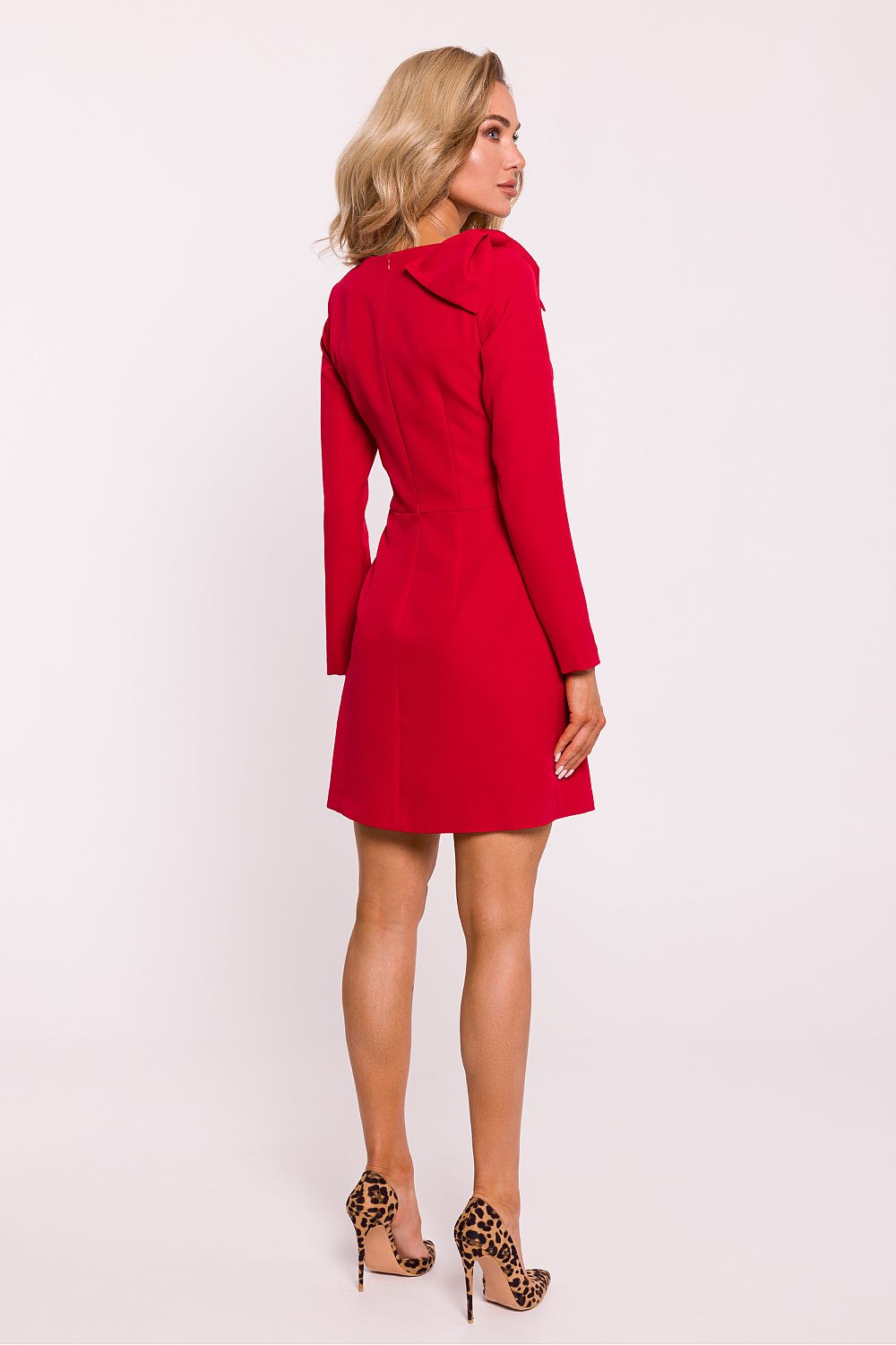 Back view of Moe's lightweight mini dress with covered zipper, illustrating its sophisticated craftsmanship and elegant fit.