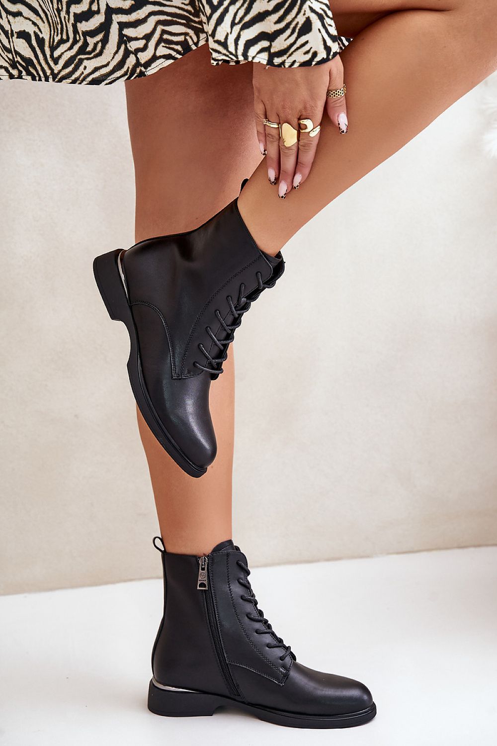 Stylish Vinceza Women's Leather Boots featuring a chic flat heel and warm shoe covers, ideal for fashionable winter wear.