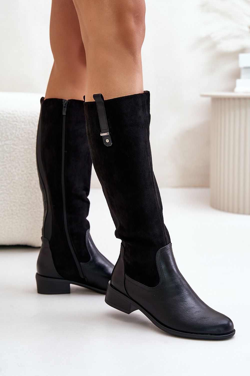 Fashionable women's thigh-high boots from Step in style displayed elegantly, highlighting their comfortable flat heel and insulated interior for all-day wear.