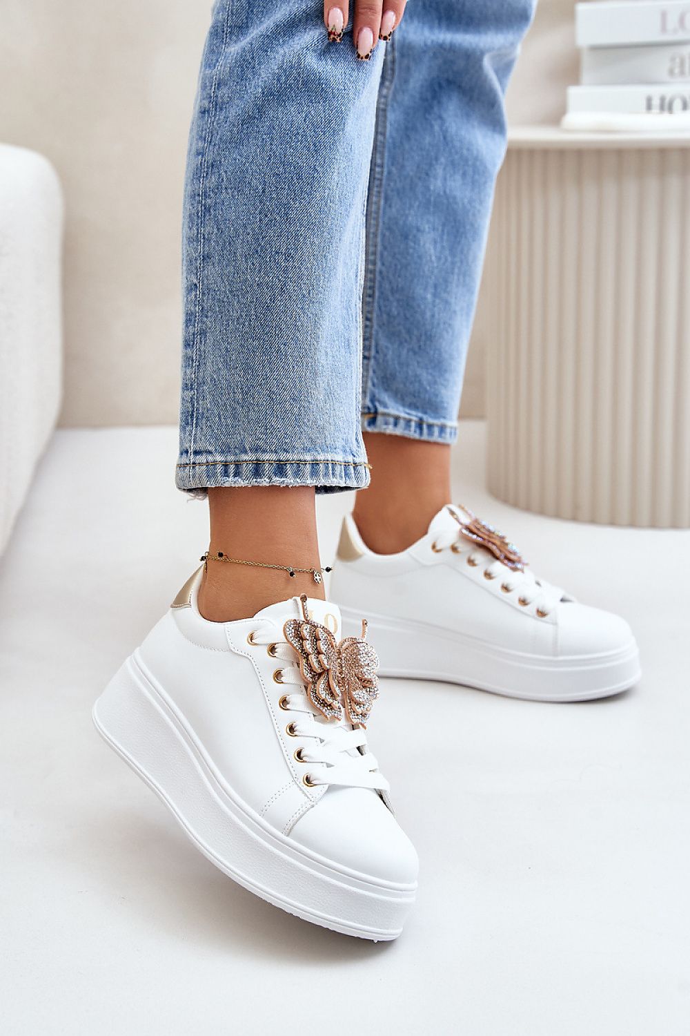 Trendy women's platform sneakers in eco leather by Step in Style, embellished with a dazzling butterfly detail, ideal for everyday elegance.