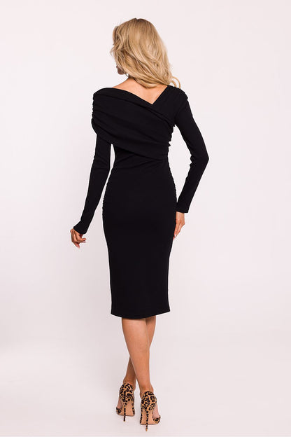 Back view of the luxury long sleeve dress by Moe, featuring a unique design and impeccable craftsmanship.