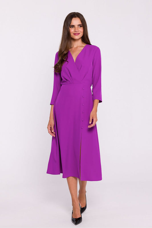 Stylove elegant daydress featuring 7/8 sleeves, high slit, and button detail, crafted from high-quality fabric for a luxurious look.