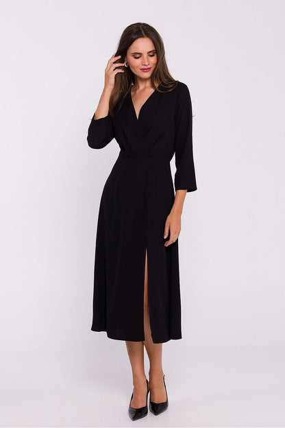 Stylove stylish dress displayed flat, highlighting the high slit and 7/8 sleeves for an effortlessly elegant look.