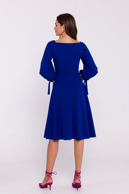 Stylove Romantic Knit Day Dress displayed elegantly on a model, showcasing its flattering over-the-knee length and adjustable tie sleeves.