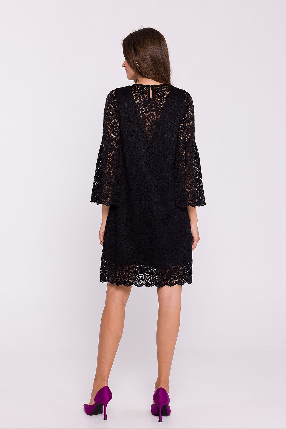 Model wearing Stylove’s elegant lace trapeze dress, demonstrating its flattering silhouette and feminine details perfect for any special occasion.