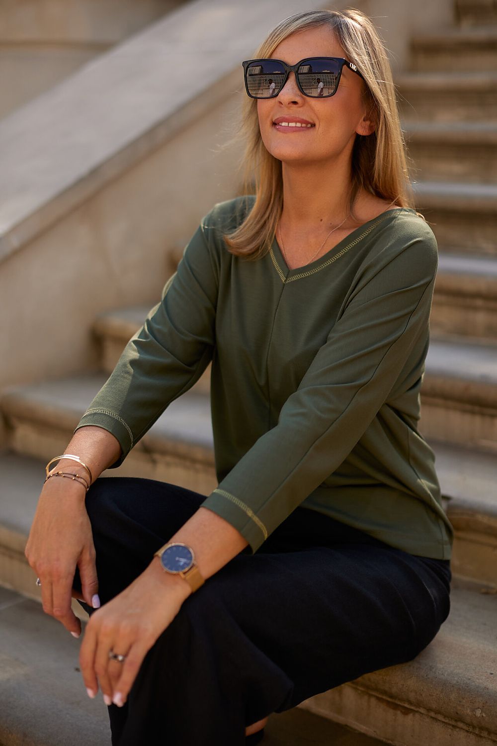 Stylish and sophisticated La Aurora blouse on a model, showcasing its elegant design suitable for various occasions.