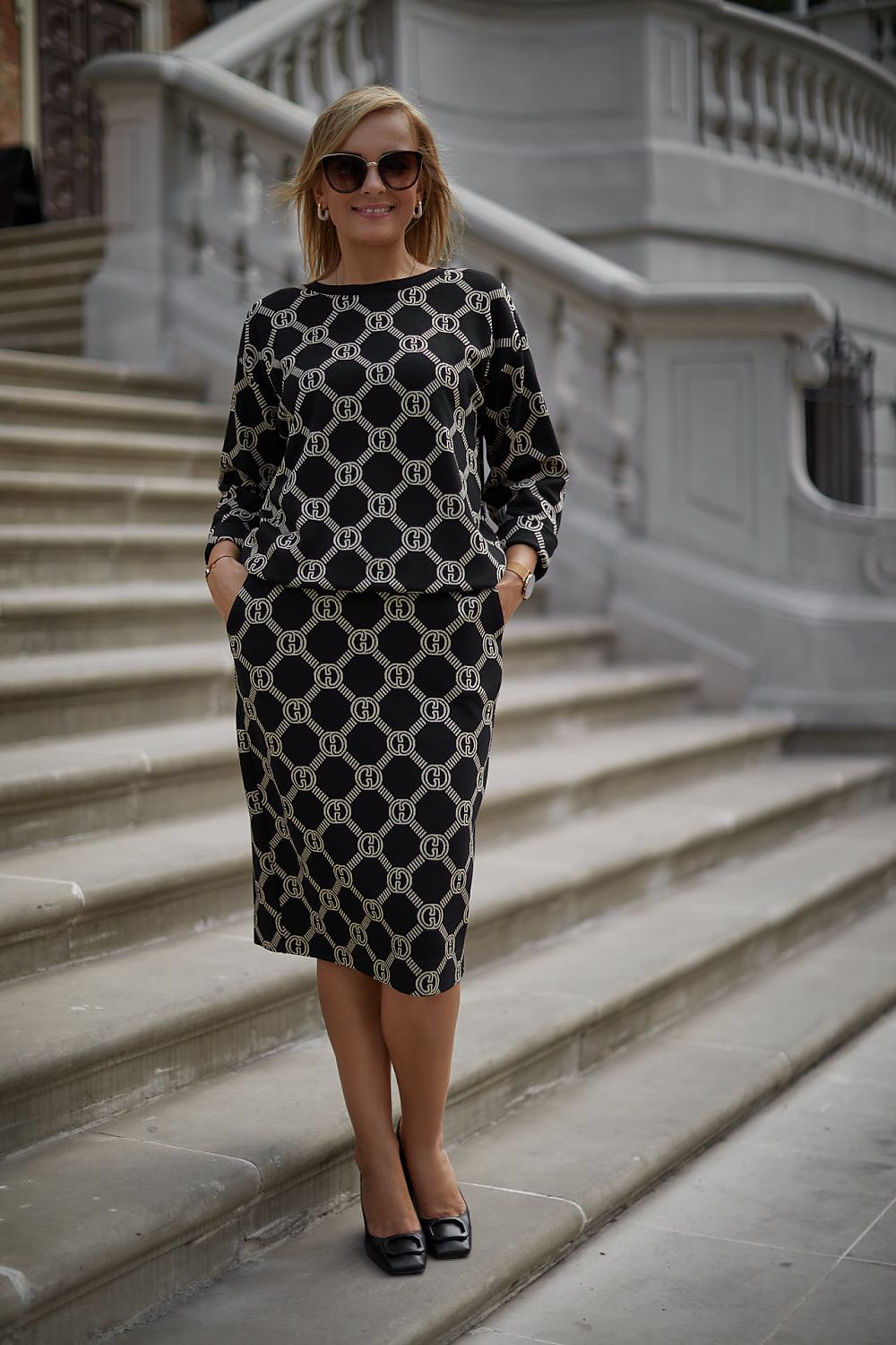 Elegant La Aurora Two-Piece Women's Set featuring a soft barnacle knit fabric with adjustable blouse and stylish skirt with pockets, ideal for sophisticated occasions.