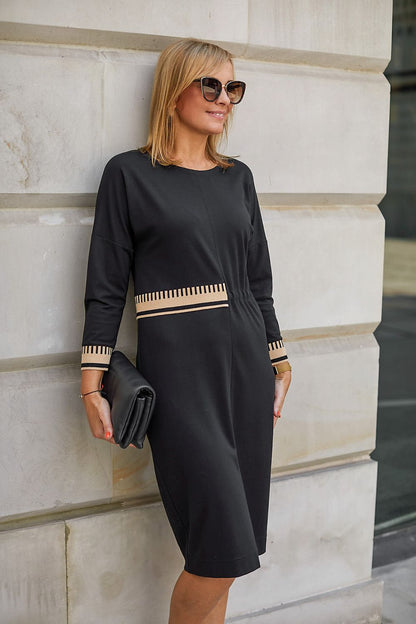 Close-up view of the luxurious knit fabric of the La Aurora women's dress, showcasing the soft texture and exquisite beige welts, ideal for mature fashion.