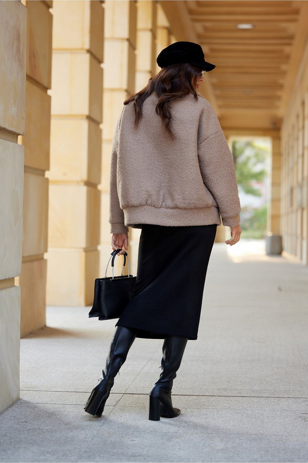 Ivon Quilted Sheepskin Jacket by Roco Fashion displayed on a hanger, highlighting its elegant shape and premium sheepskin material.